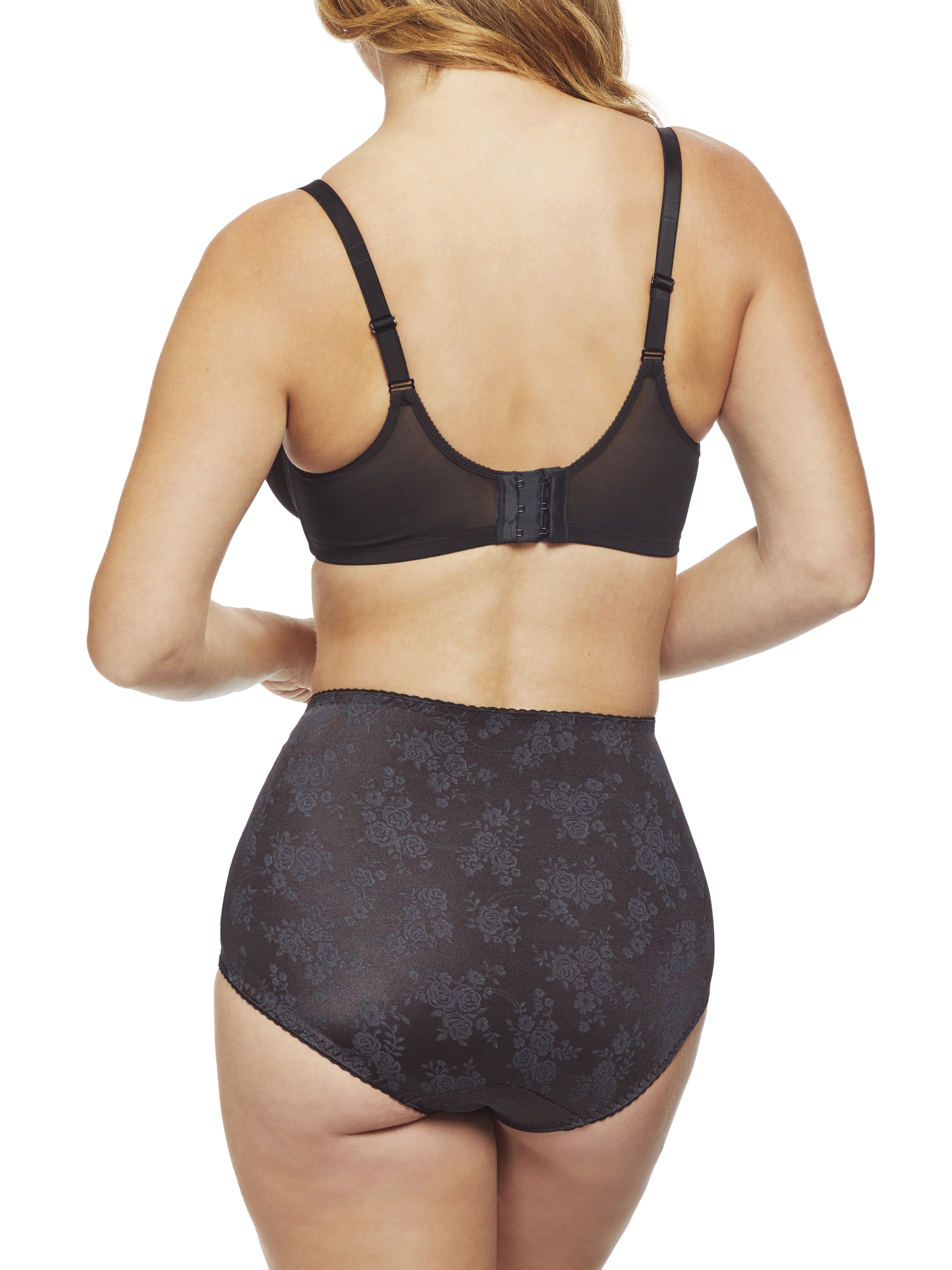 a woman wearing black tummy control underwear shapewear