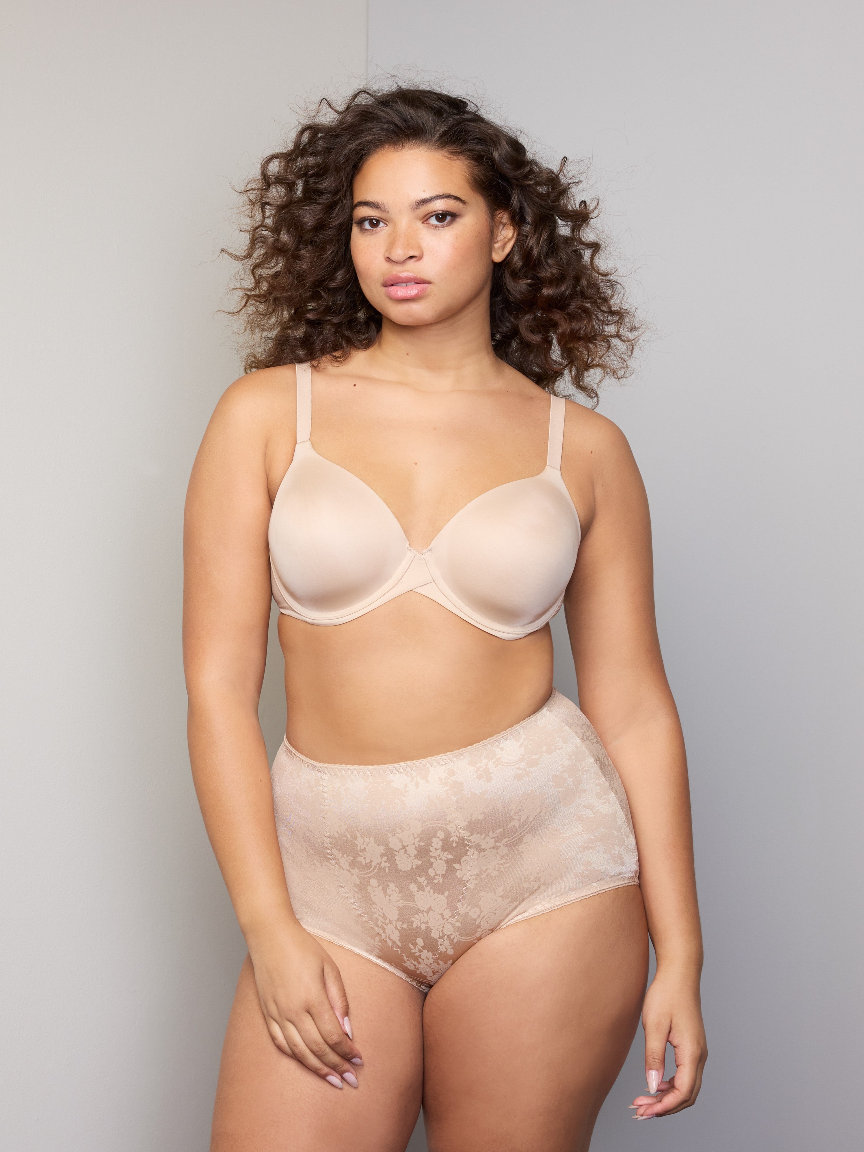 a woman wearing nude tummy control underwear shapewear