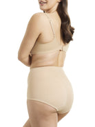 a woman wearing nude tummy control underwear shapewear