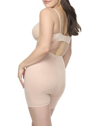 a woman wearing a nude tummy control body shaper short shapewear