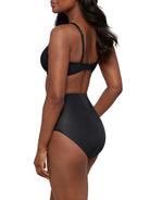 woman wearing a black bra and black shaping brief