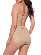woman wearing a beige bra and beige shaping brief