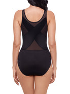 a woman wearing a black shaping bodysuit body shaper