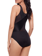 a woman wearing a black shaping bodysuit body shaper