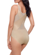 a woman wearing a nude shaping bodysuit body shaper