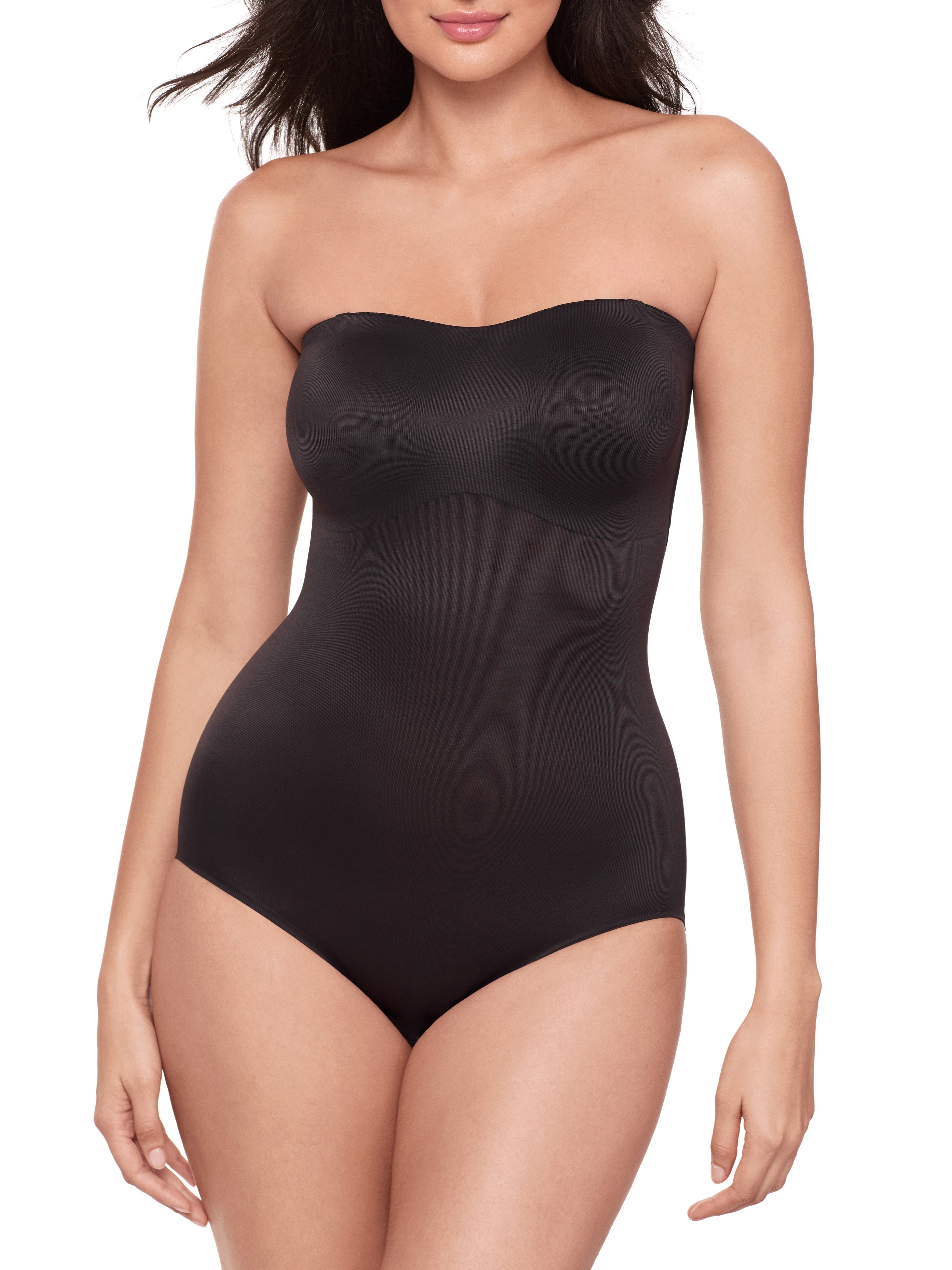 a woman wearing a black strapless shapewear bodysuit total body shaper