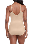 a woman wearing a nude shaping bodysuit shapewear