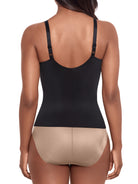 a woman wearing a black tummy control shaping cami shapewear