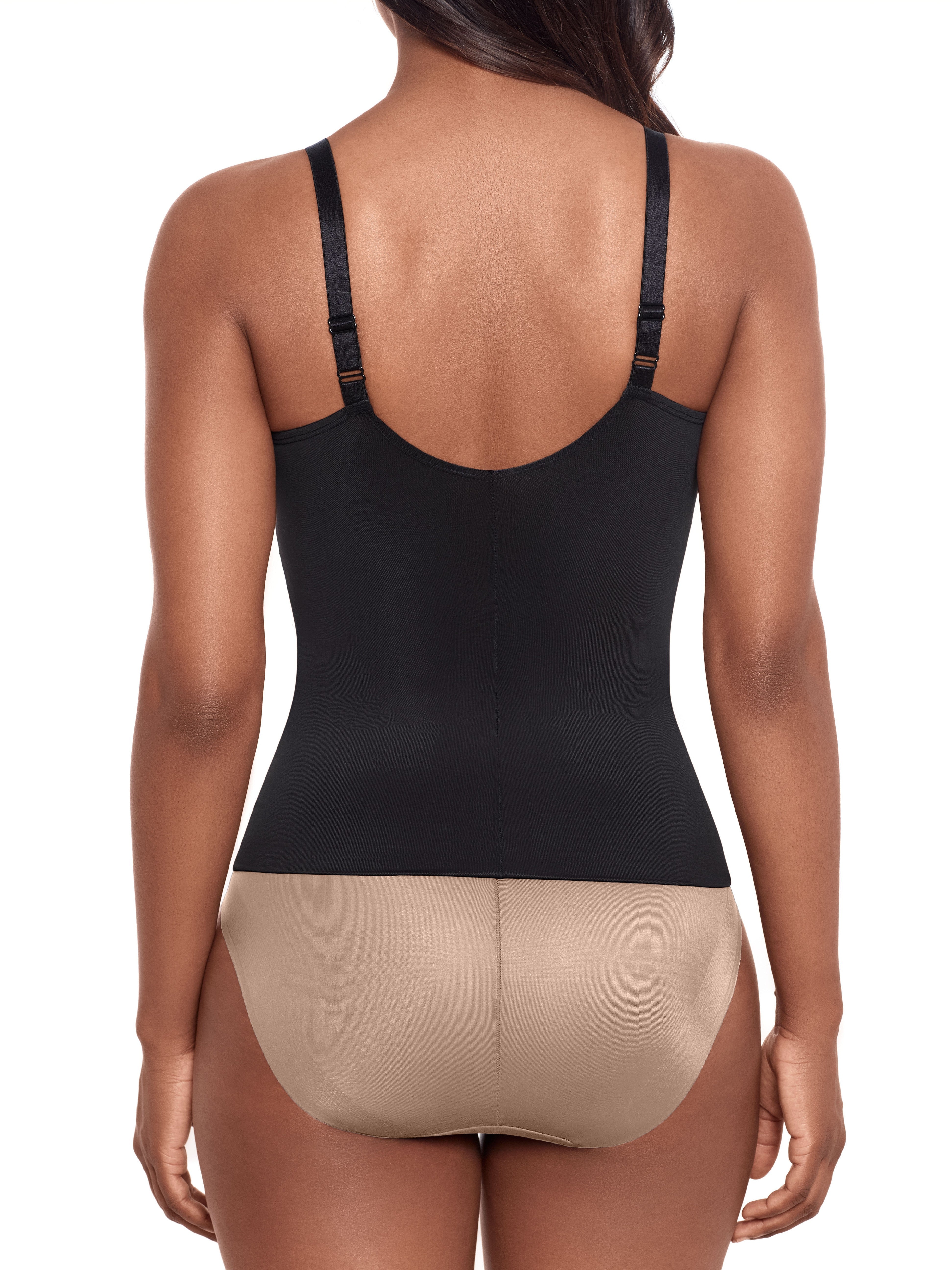a woman wearing a black tummy control shaping cami shapewear