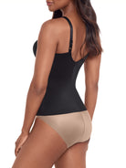 a woman wearing a black tummy control shaping cami shapewear