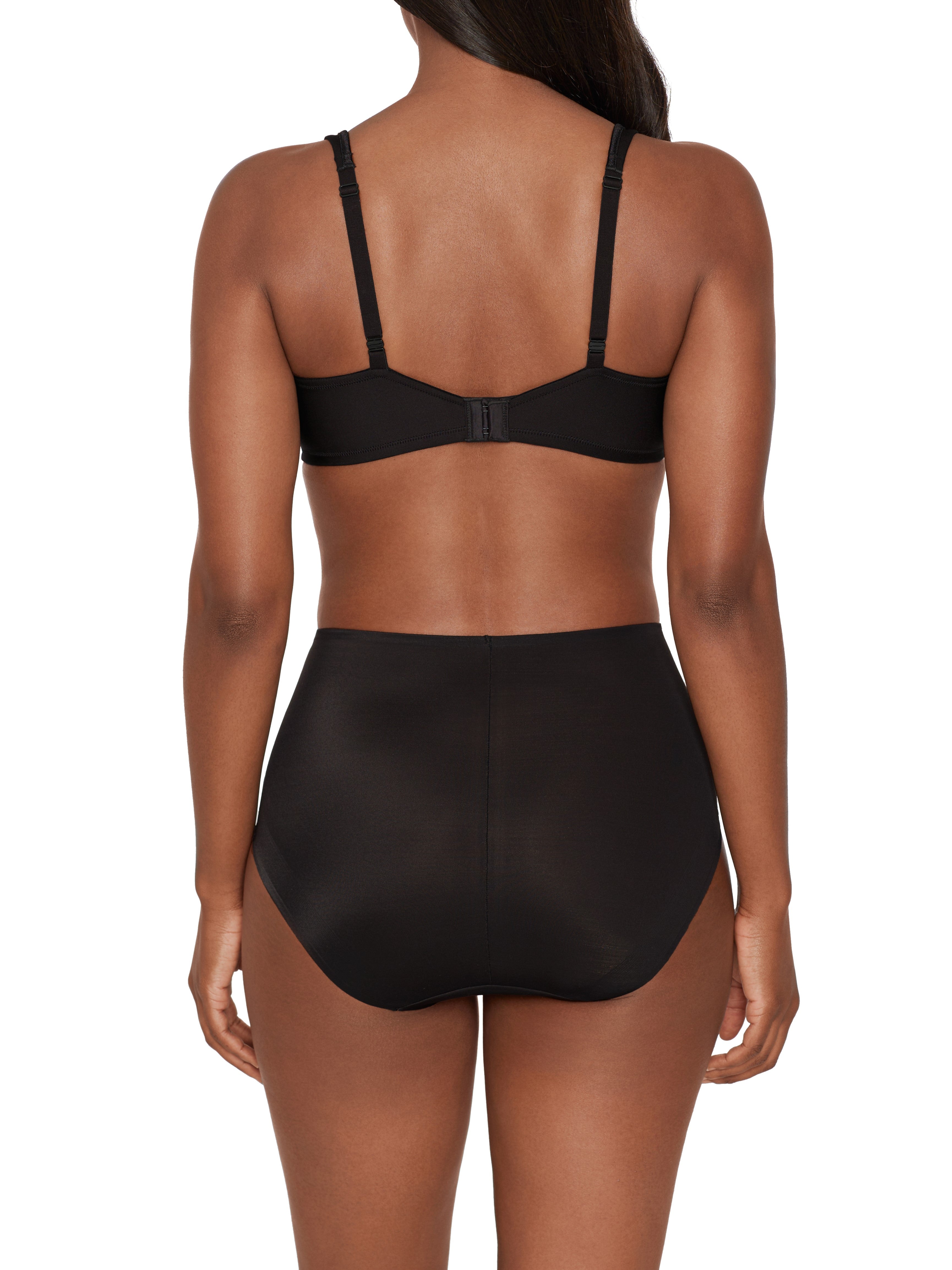 a woman wearing black tummy control underwear shapewear