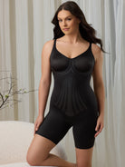 a woman kneeling on a chair wearing a black tummy control body shaper all-groups