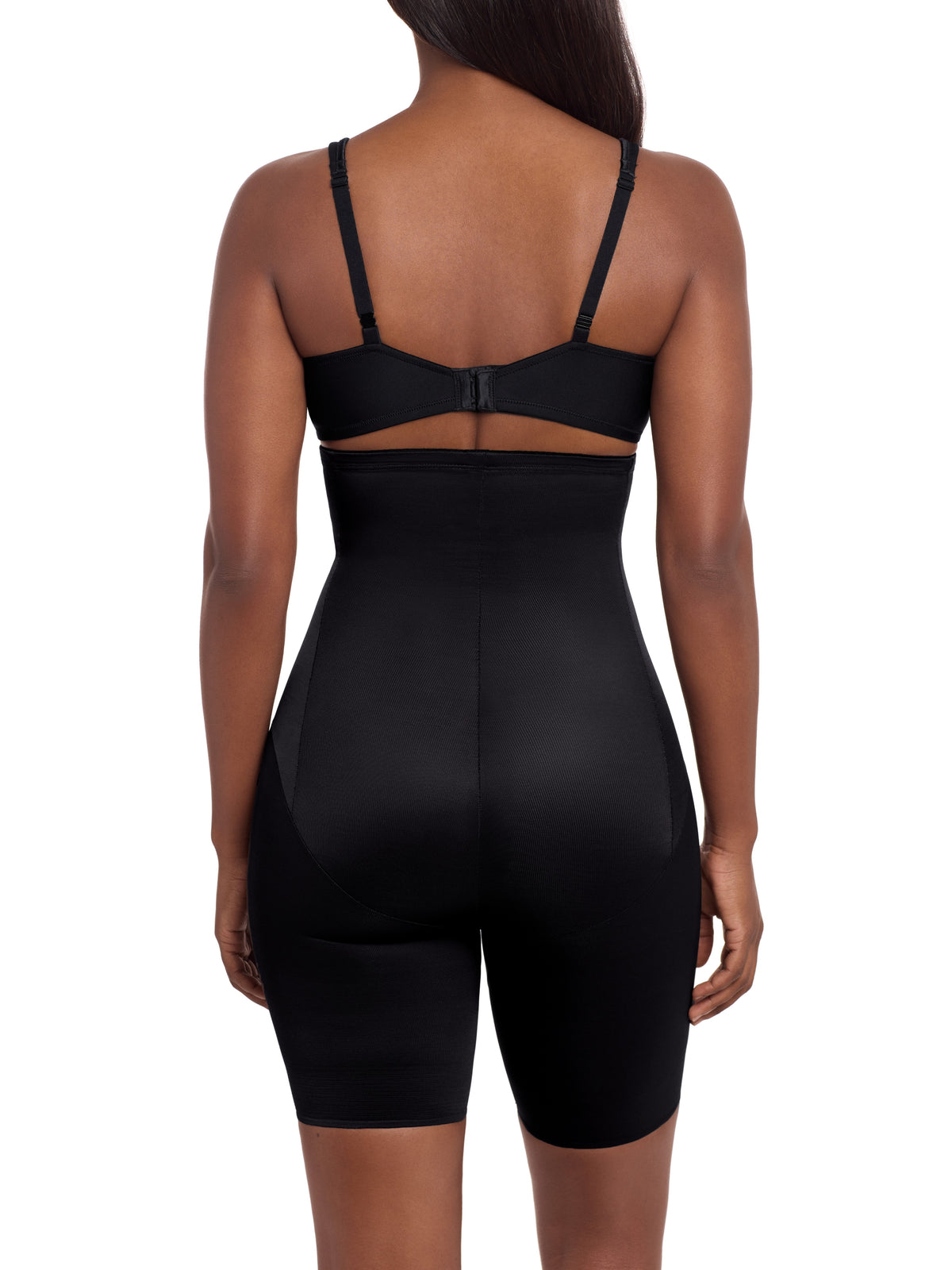 a woman wearing a black high waisted tummy control thigh slimmer shaping short miraclesuit shapewear