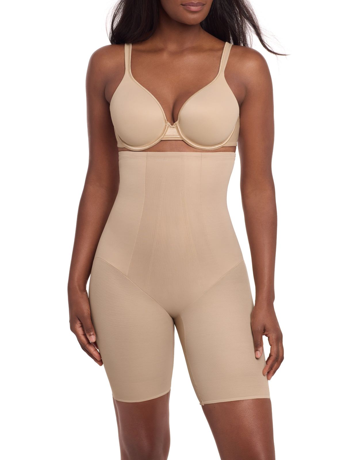 a woman wearing a beige high waisted tummy control thigh slimmer shaping short miraclesuit shapewear