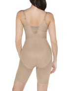 a woman wearing a nude open bust torsette body shaper sheer shapewear