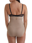 a woman wearing nude high waisted tummy control underwear sheer shapewear