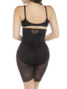 a woman wearing a black high waisted sheer shapewear short body shaper