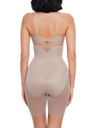 a woman wearing a nude high waisted sheer shapewear short body shaper