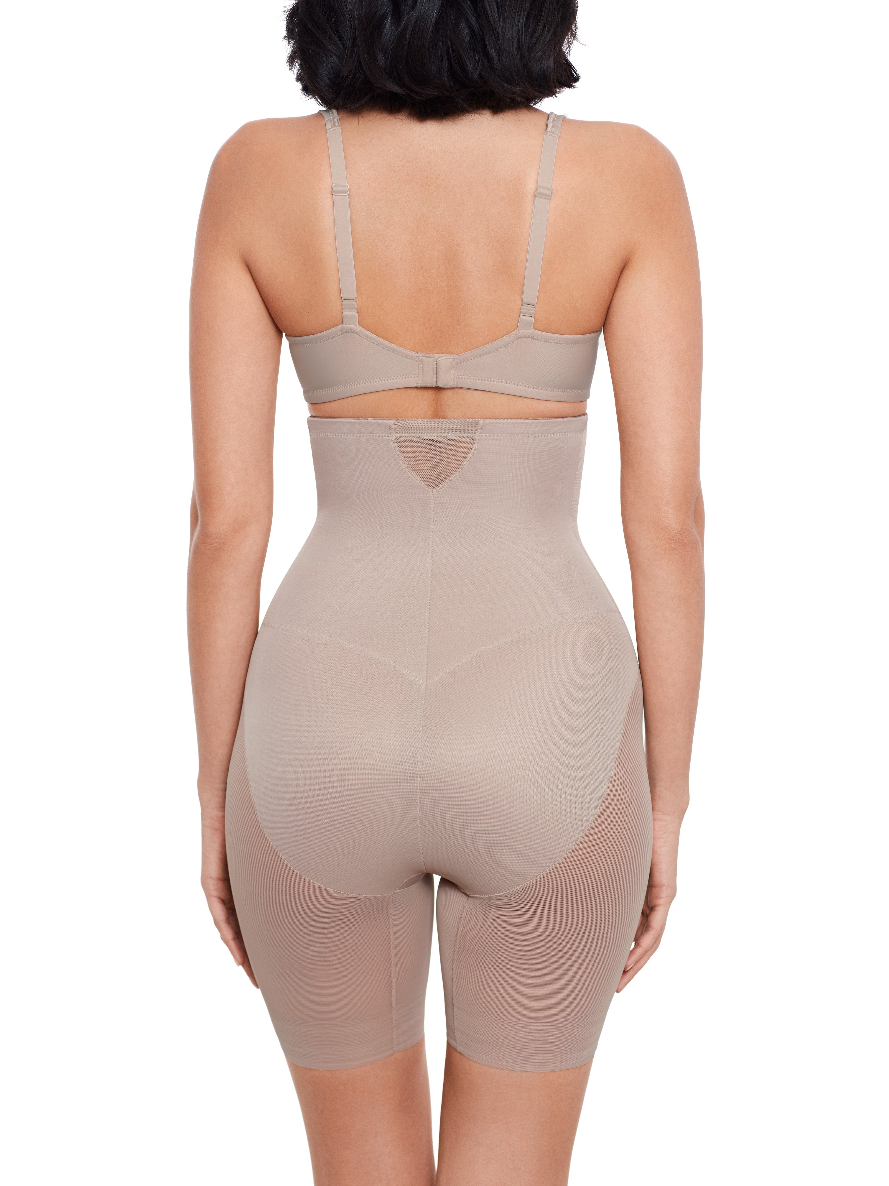 a woman wearing a nude high waisted sheer shapewear short body shaper