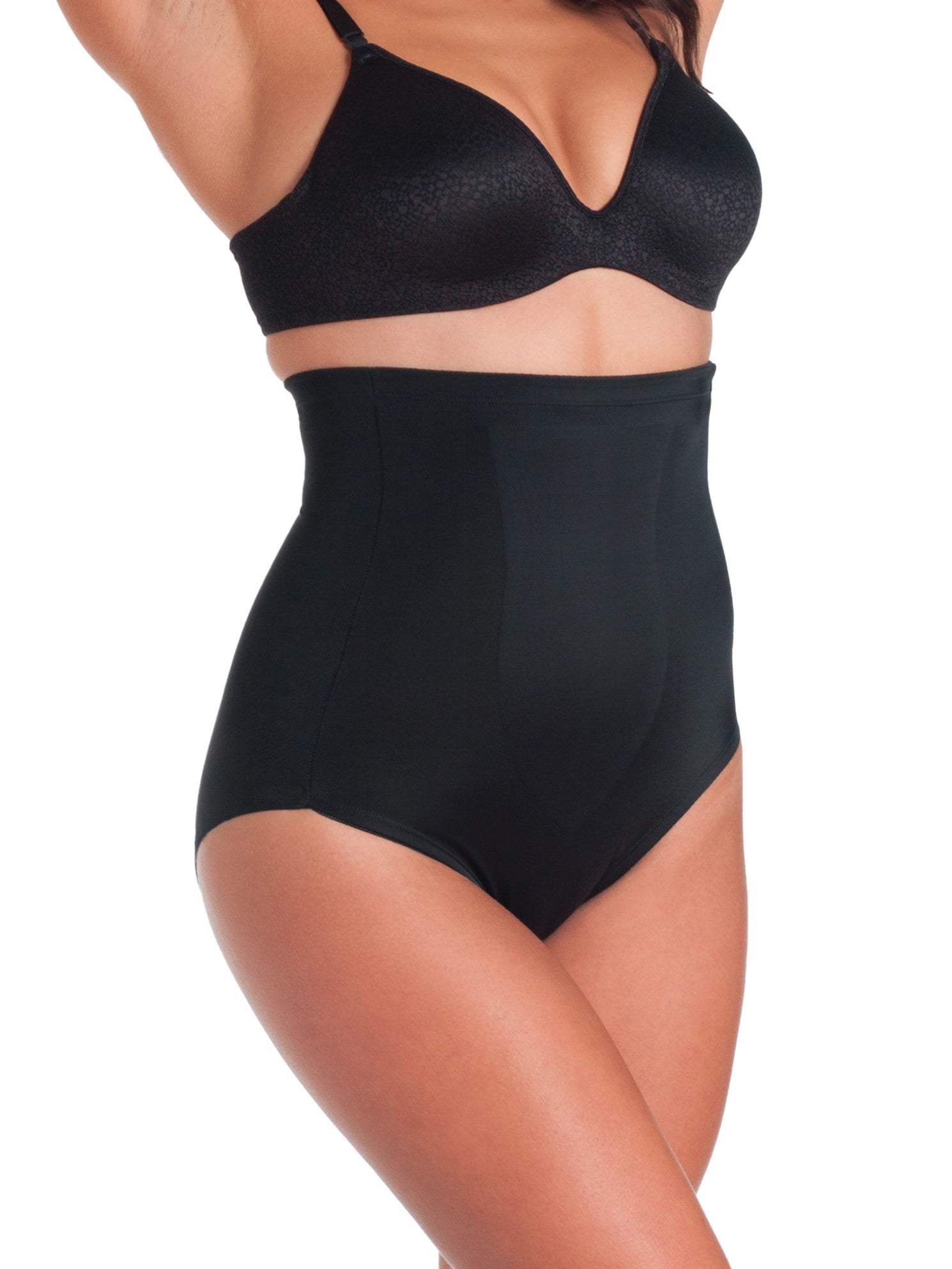a woman wearing black high waisted tummy control underwear shapewear