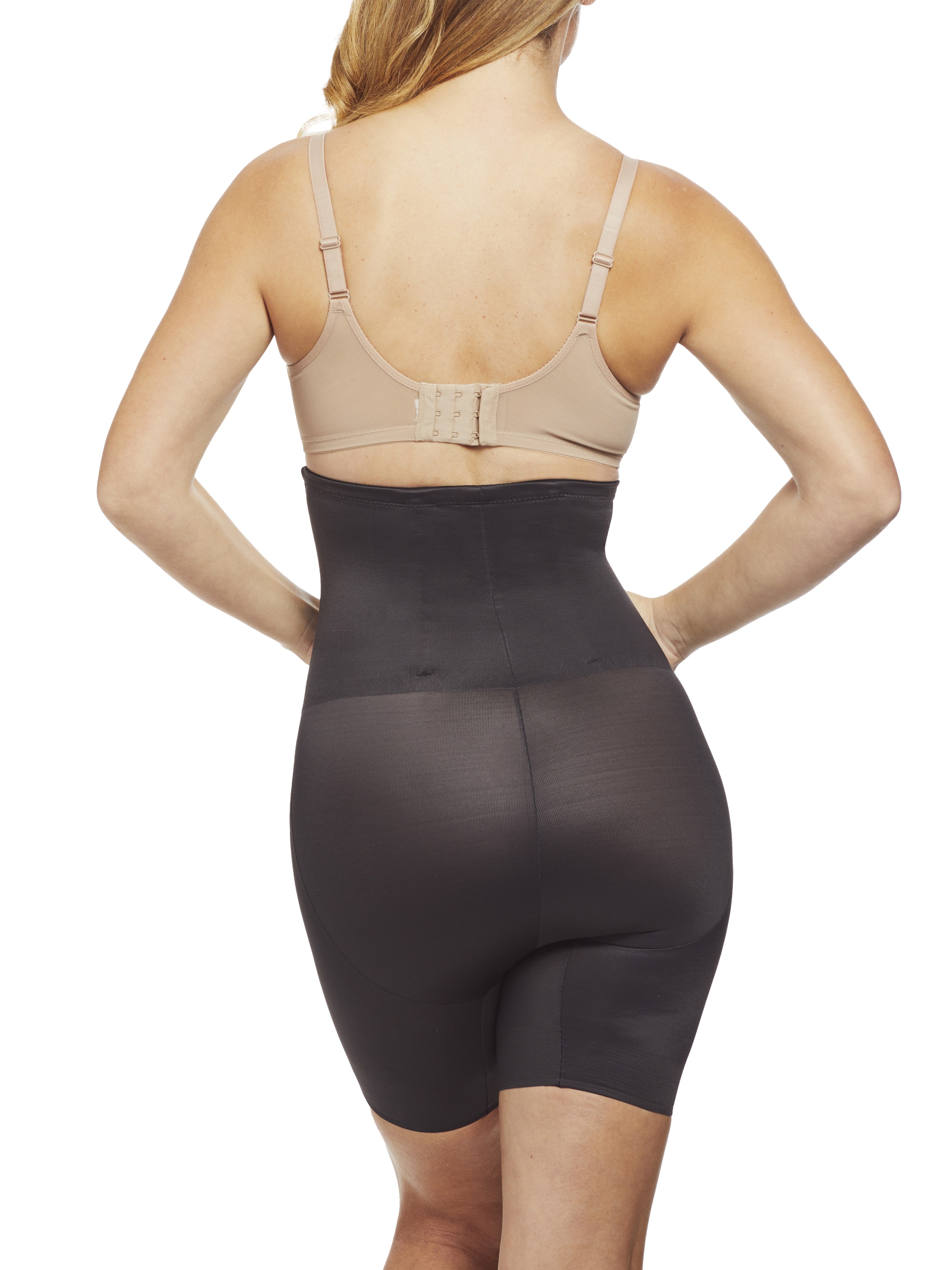 a woman wearing a black shaping short