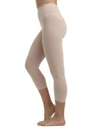 a woman wearing nude tummy control leggings shapewear