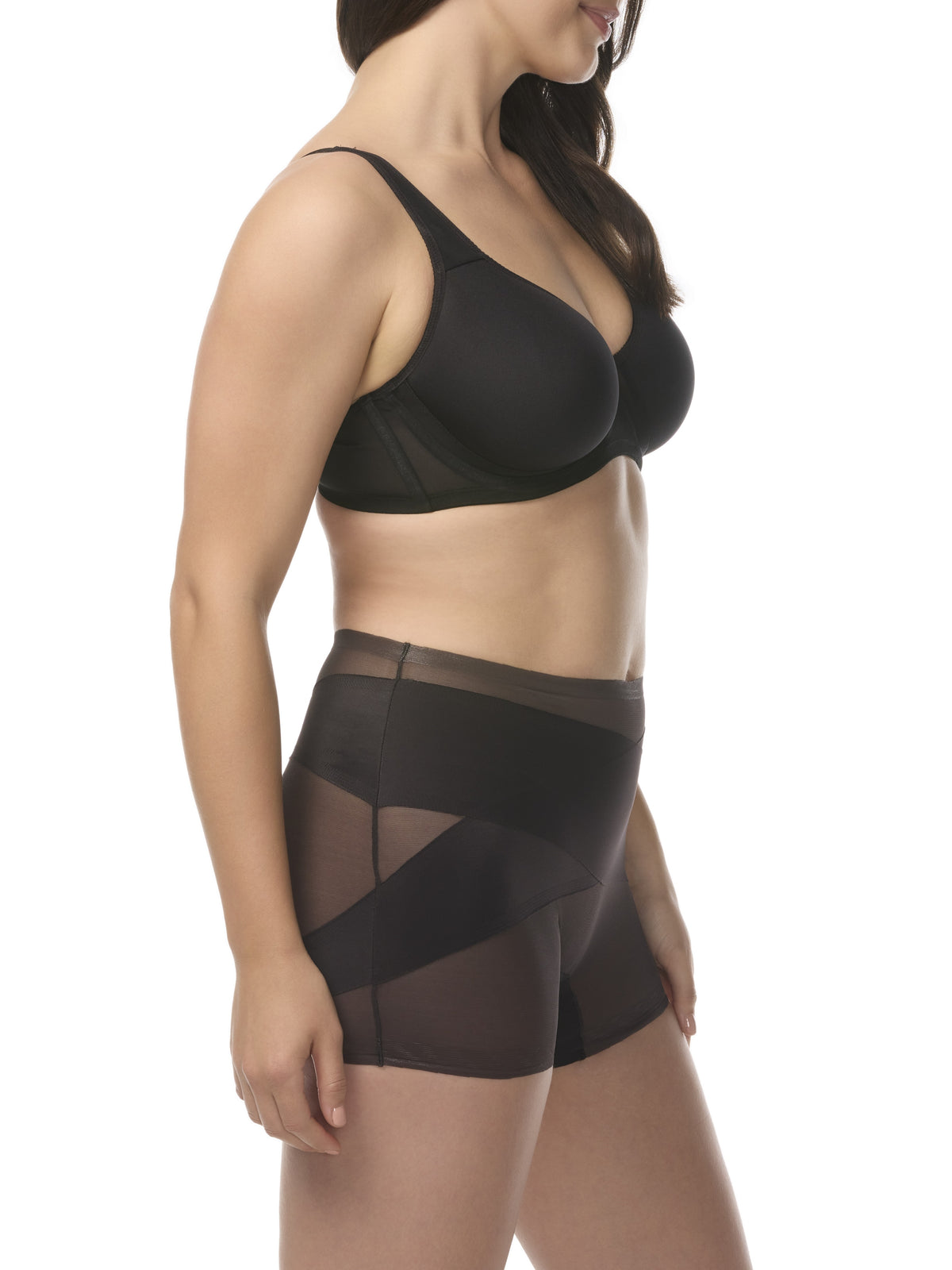 A woman wearing a sheer black shaping boyshort with shaping panels