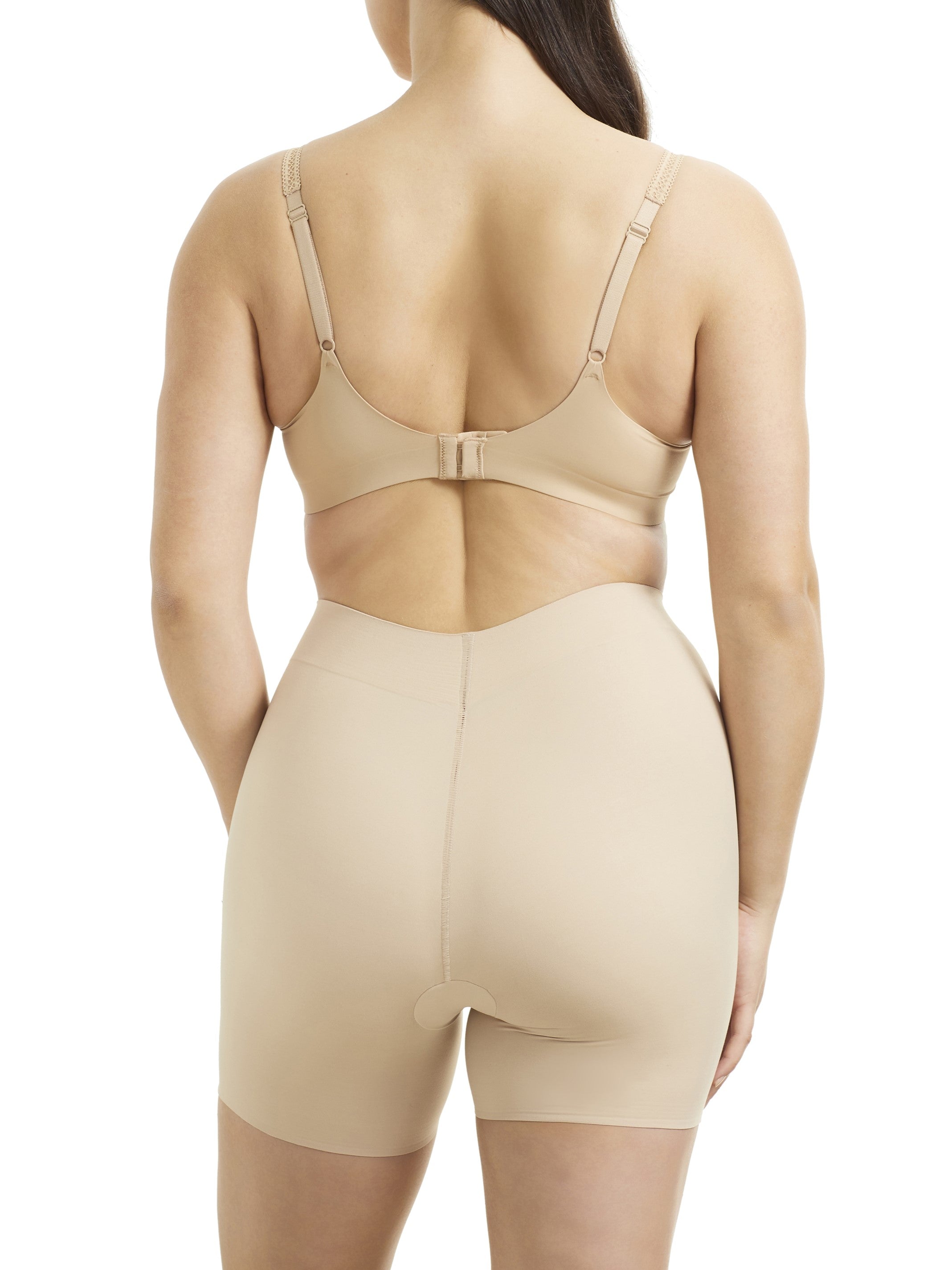 a woman wearing a nude tummy control shapewear short