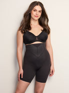 a woman wearing a black high waisted tummy control shapewear short