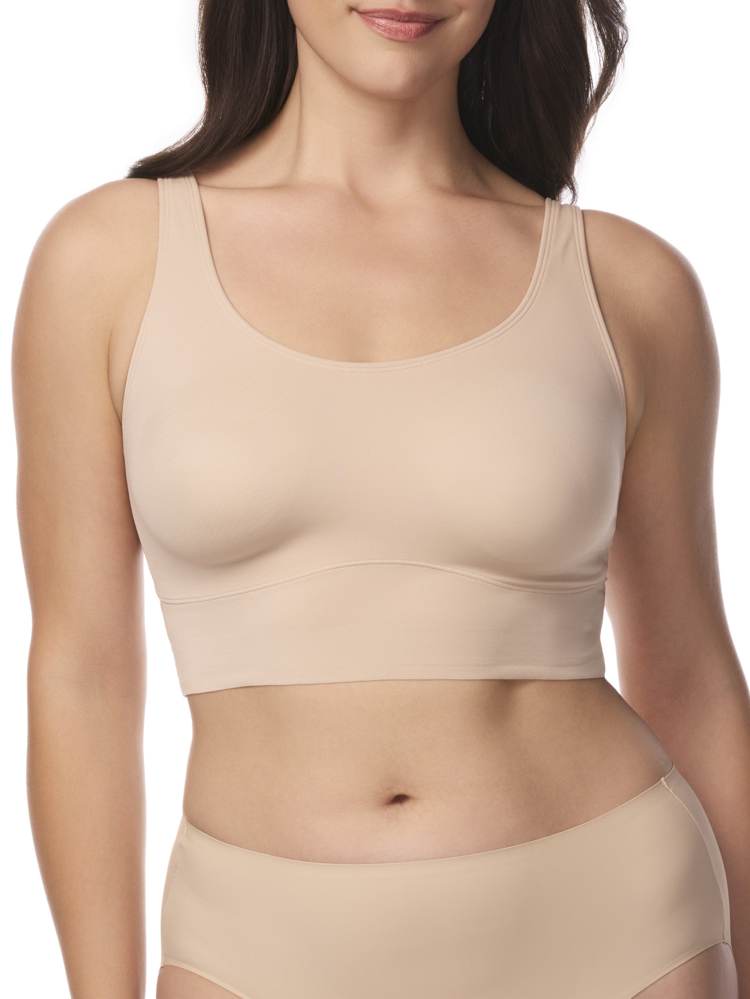 a woman wearing a beige underarm smoothing bralette