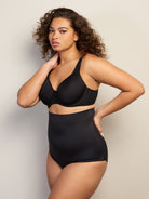 a woman wearing black high waisted tummy control underwear
