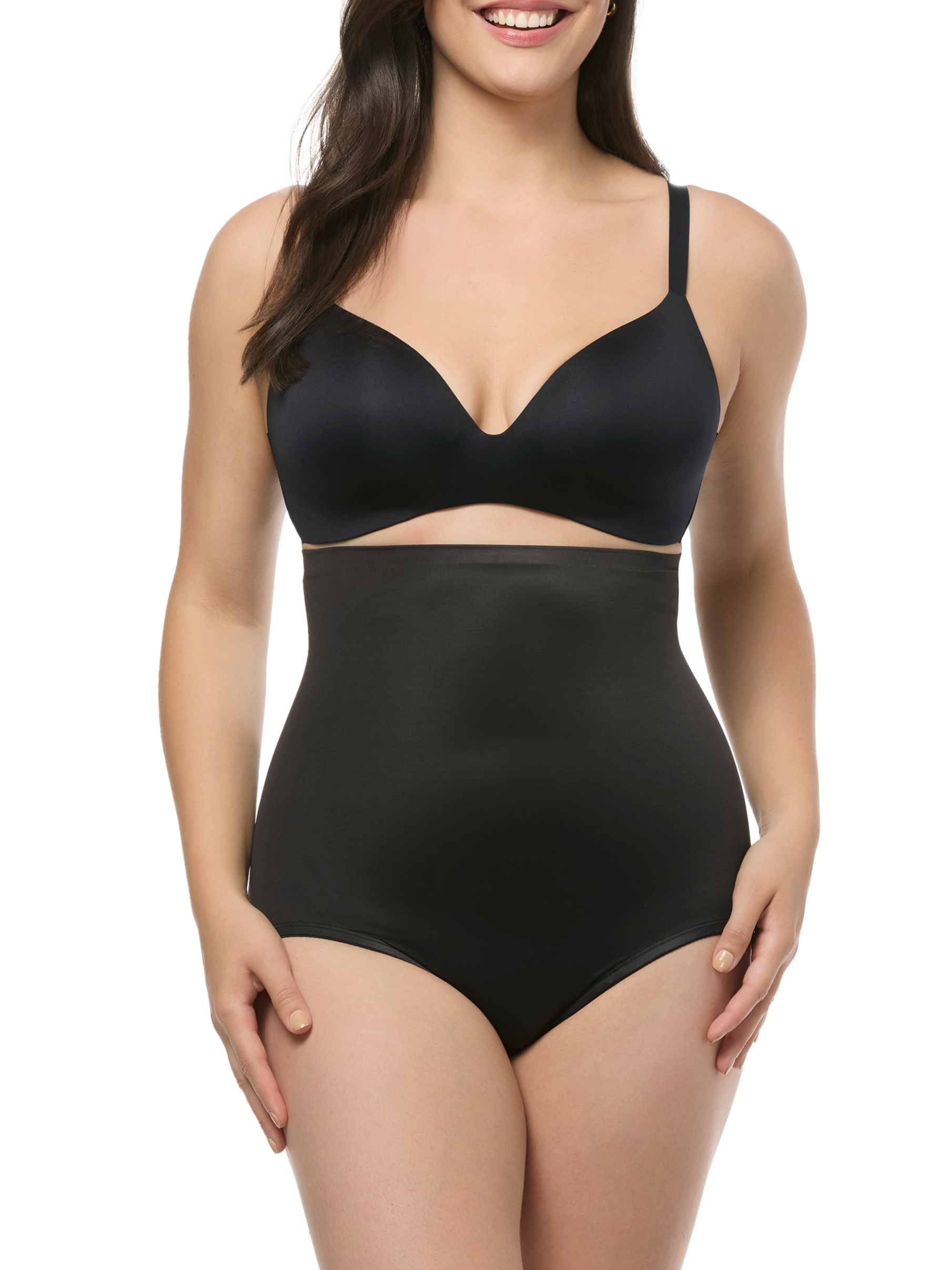 Woman wearing a black shapewear panty on a white background