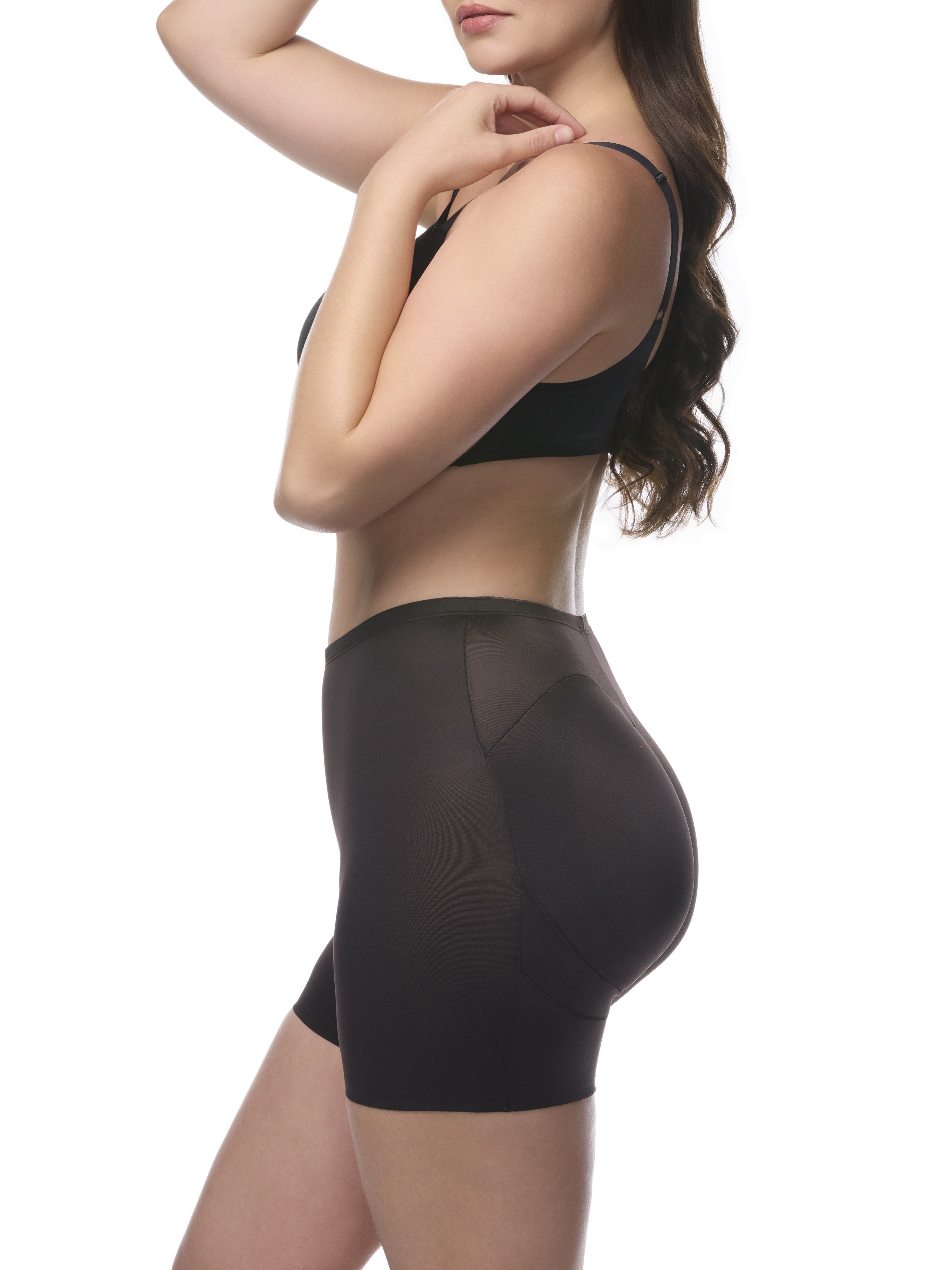 a woman wearing a black padded butt shaping short