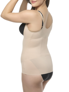 Woman wearing a beige shaper on a white background