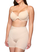 a woman wearing nude tummy control shorts