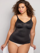 a woman wearing a black tummy control shaping camisole shapewear all-groups