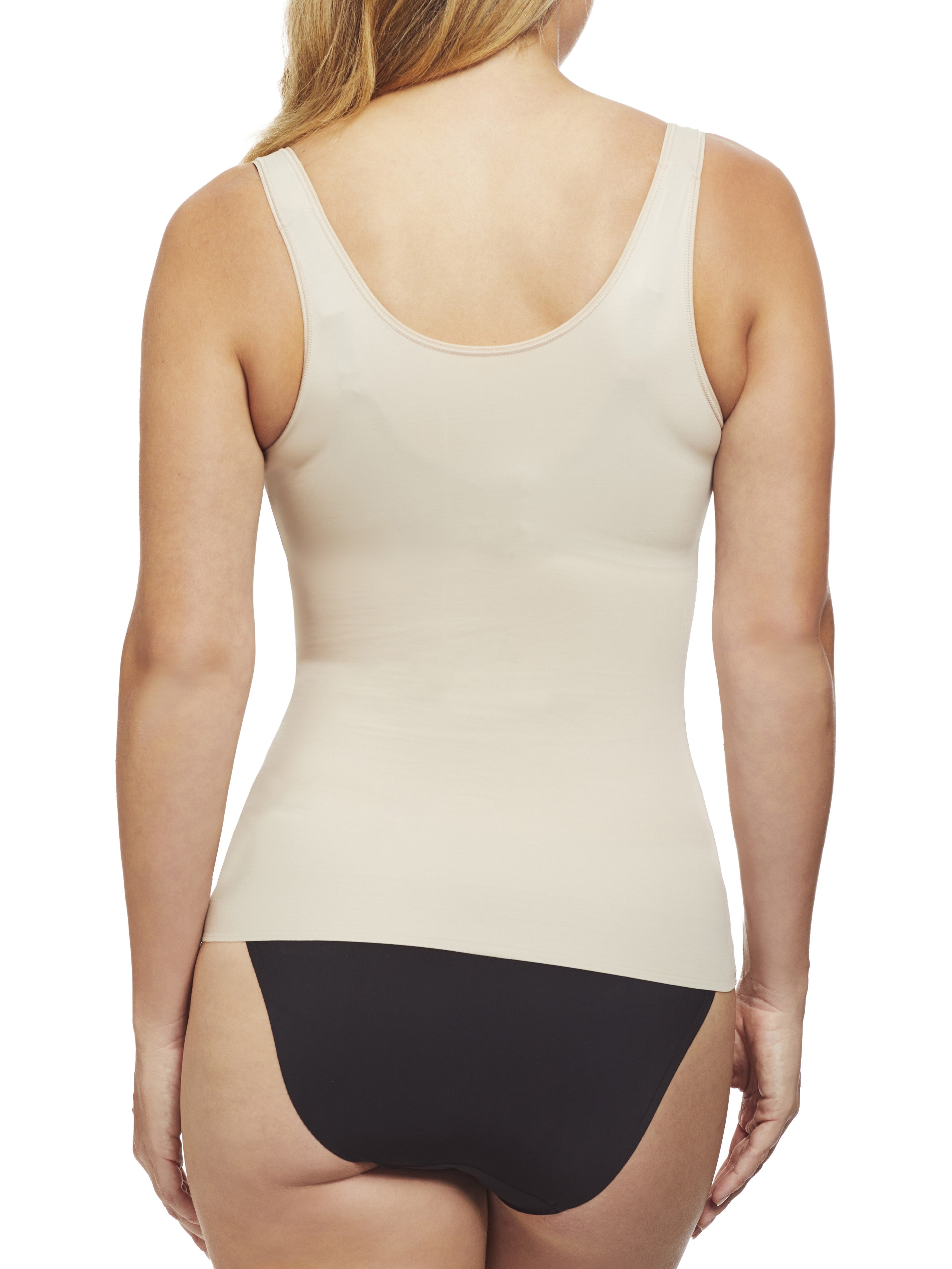 a woman wearing a nude open bust shaping camisole shapewear