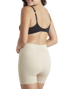 a woman wearing nude tummy control shaper shorts shapewear