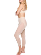 a woman wearing nude butt lifting tummy control leggings shapewear