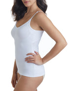 a woman wearing a white tummy control shaping camisole shapewear
