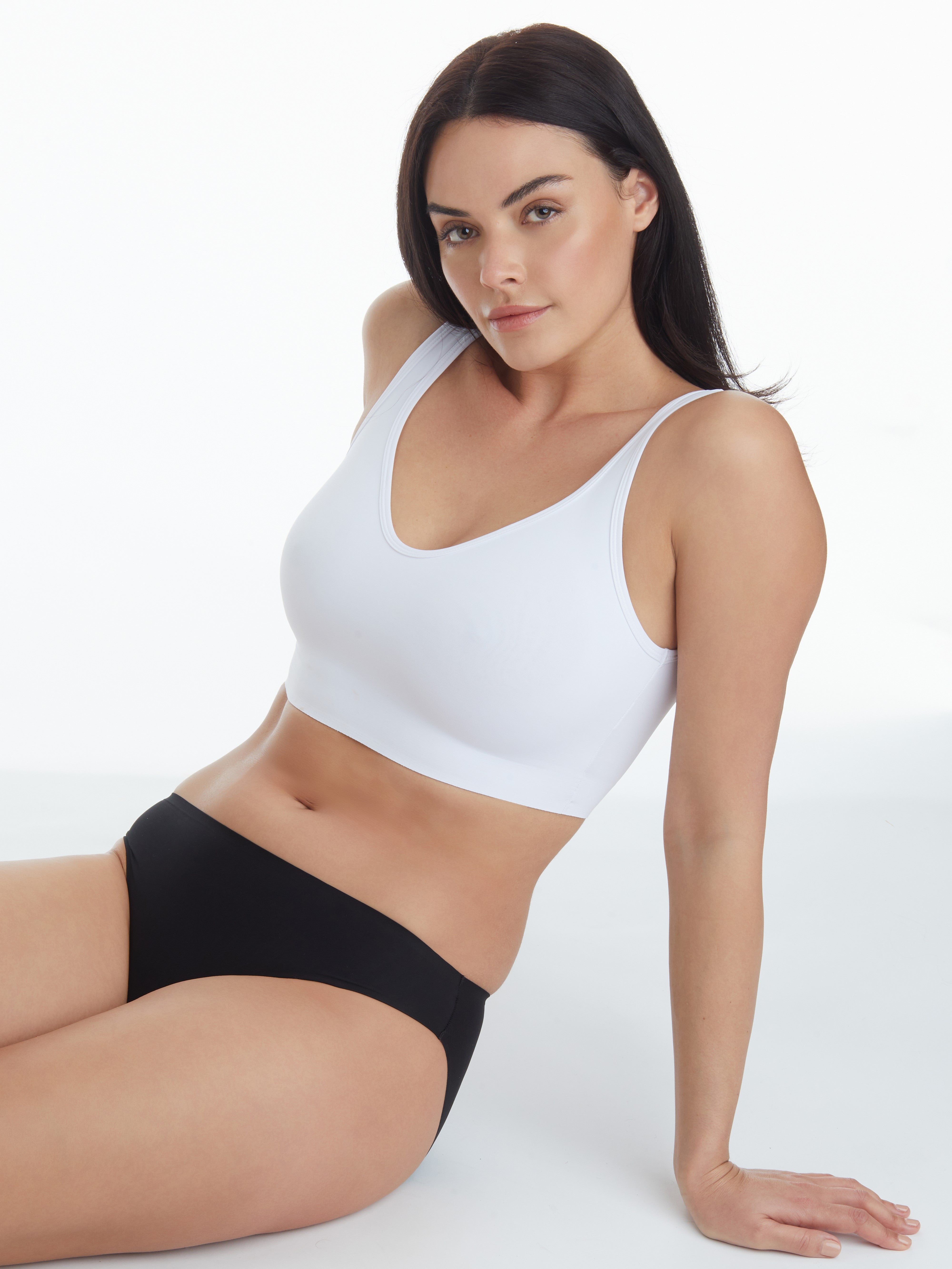 a woman sitting down wearing a wirefree bra all-groups