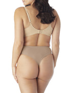a woman wearing nude tummy control thong underwear