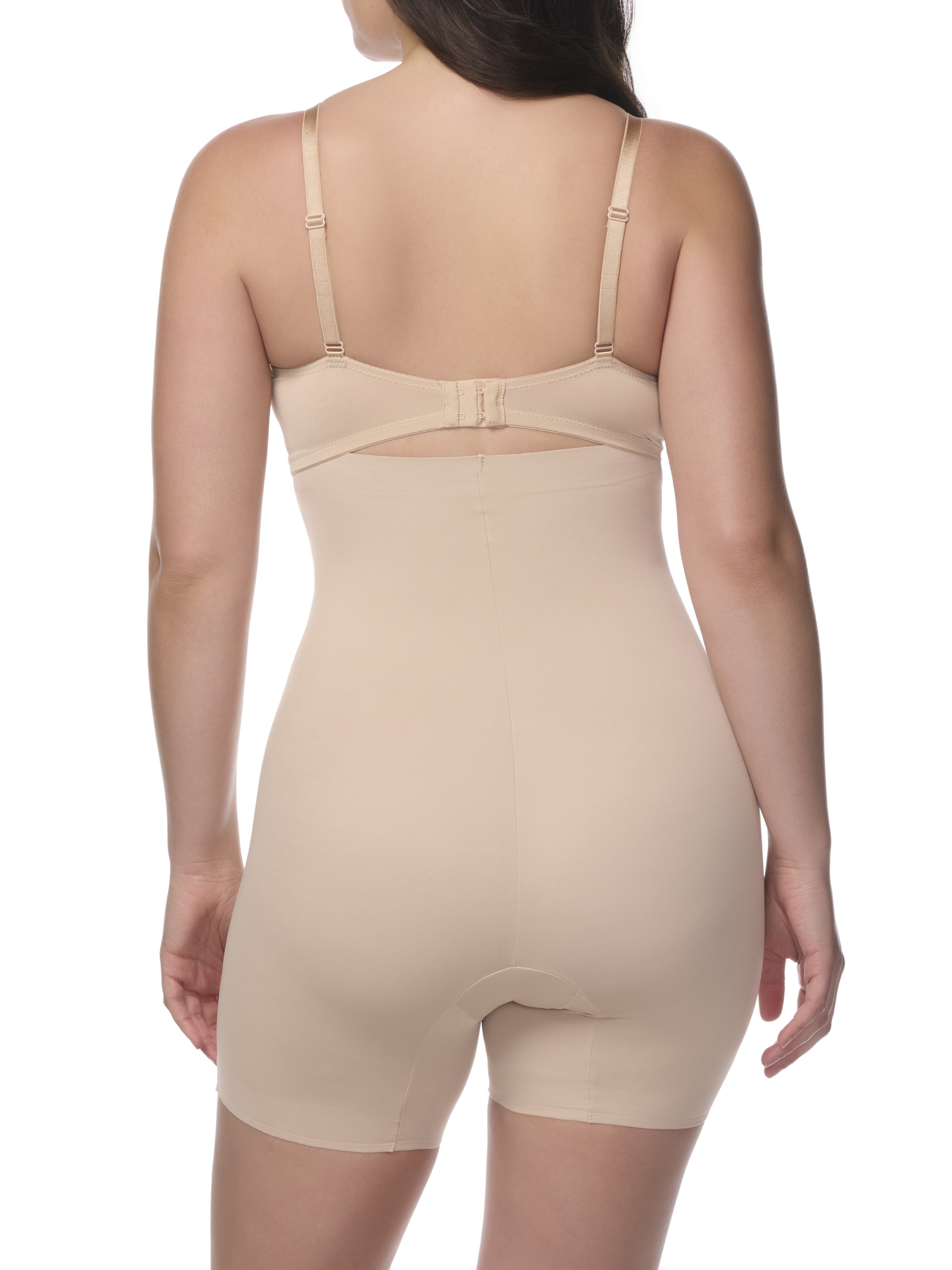 Beige shapewear shorts worn by a model on a white background