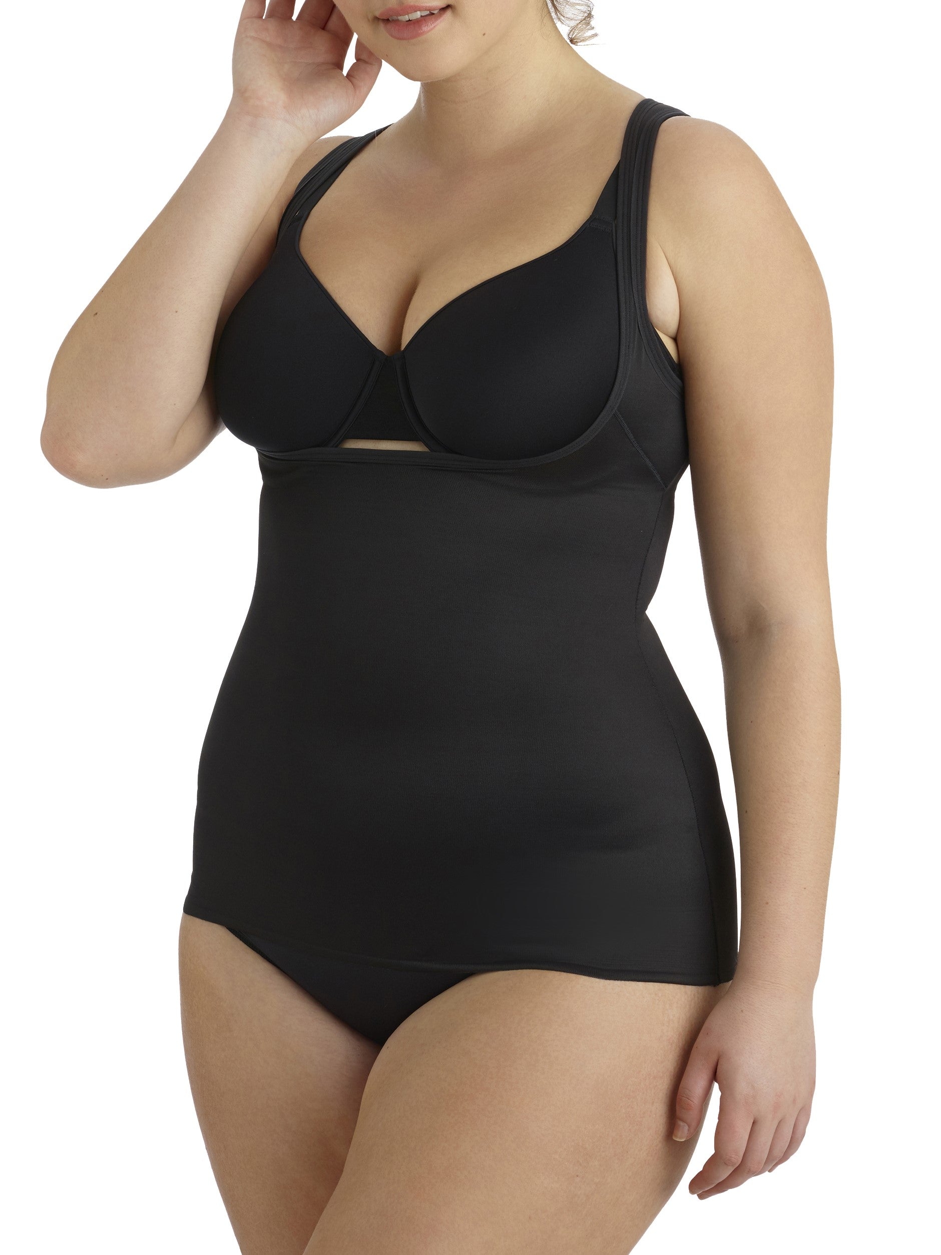 a woman wearing a black plus size open bust shaping camisole tank top