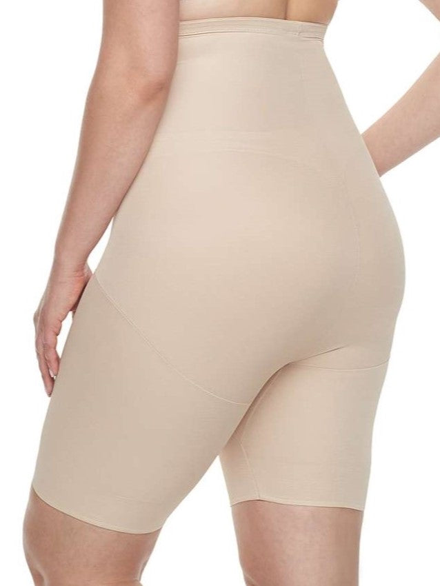 a woman wearing a nude plus size tummy control shapewear short