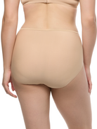 a woman wearing a beige brief panty