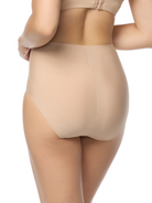 a woman wearing a beige brief panty women's underwear