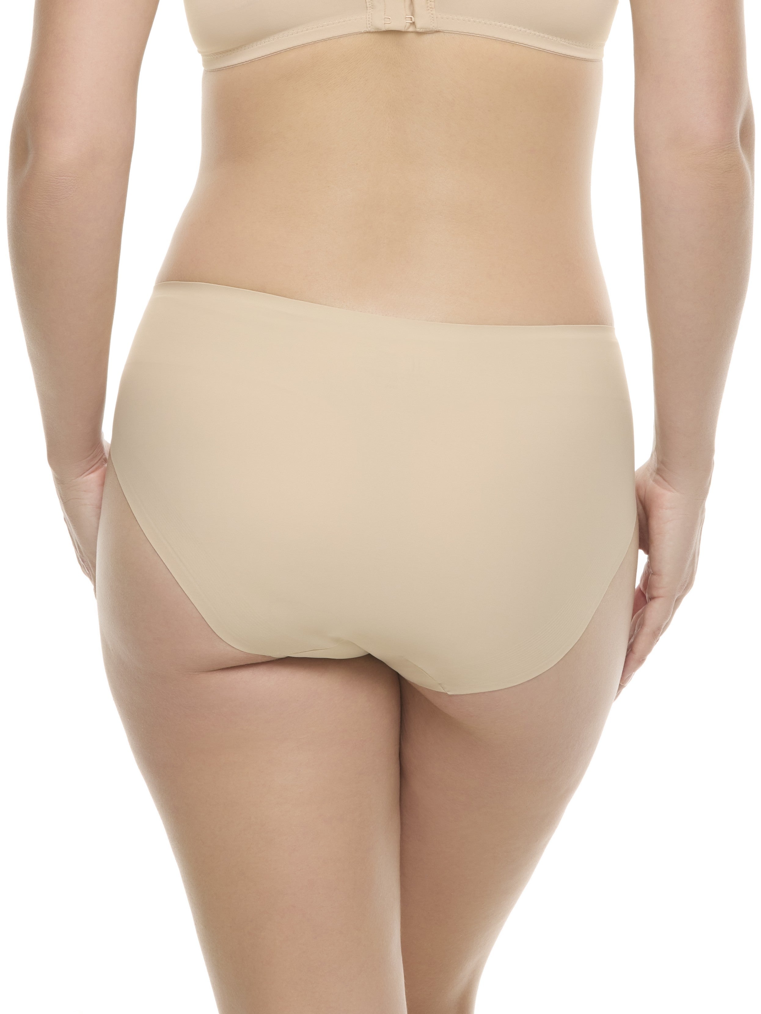 a woman wearing a beige high-cut brief panty underwear