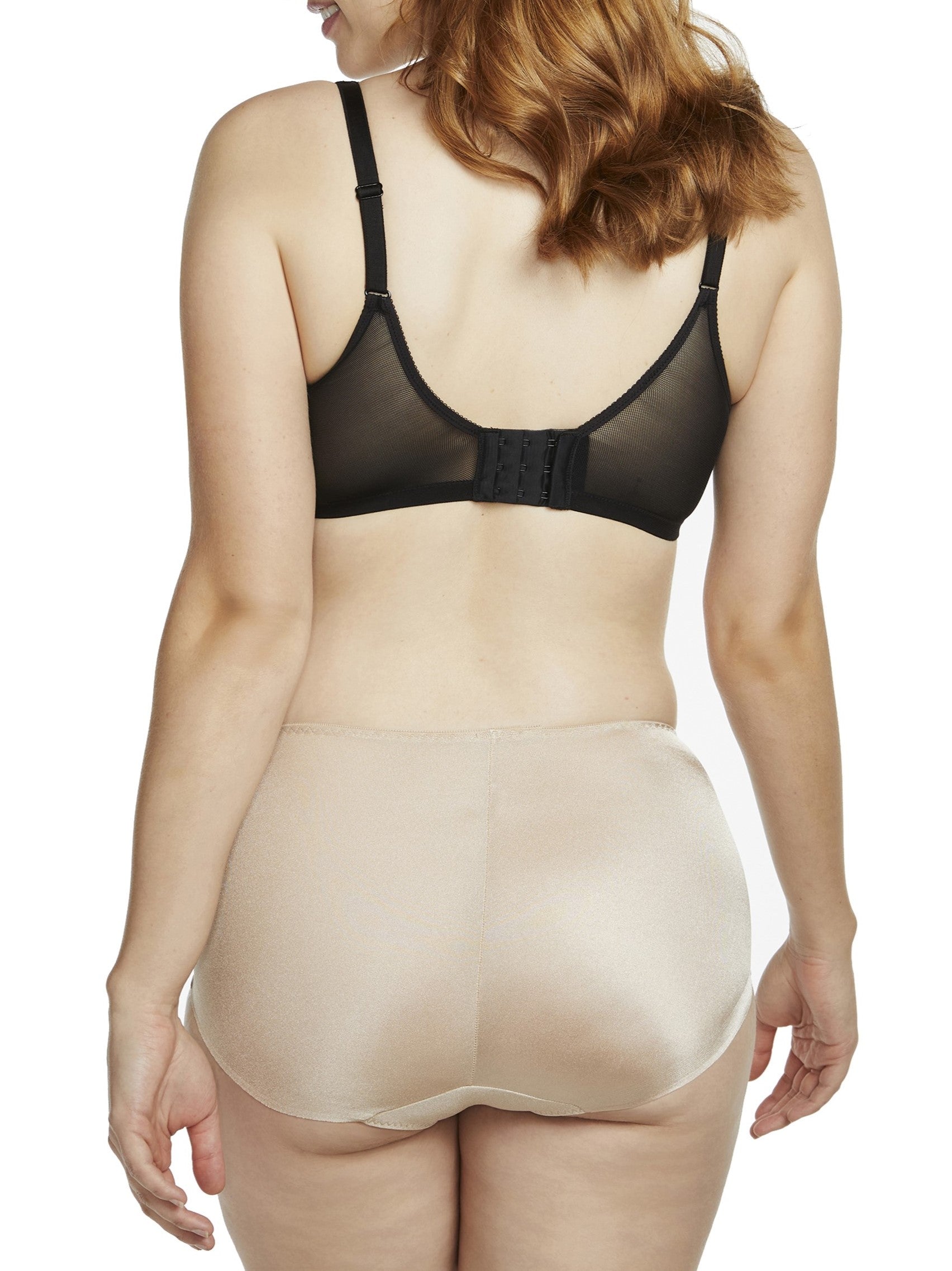 a woman wearing a beige shaping brief