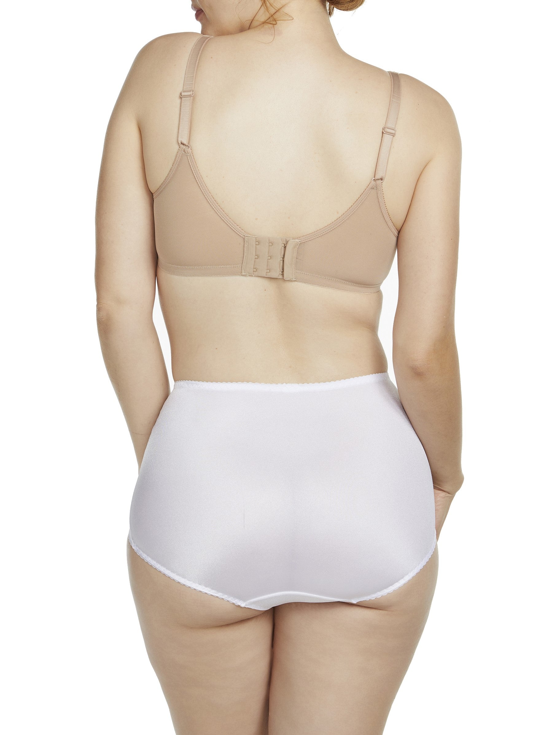 a woman wearing a white shaping brief shapewear